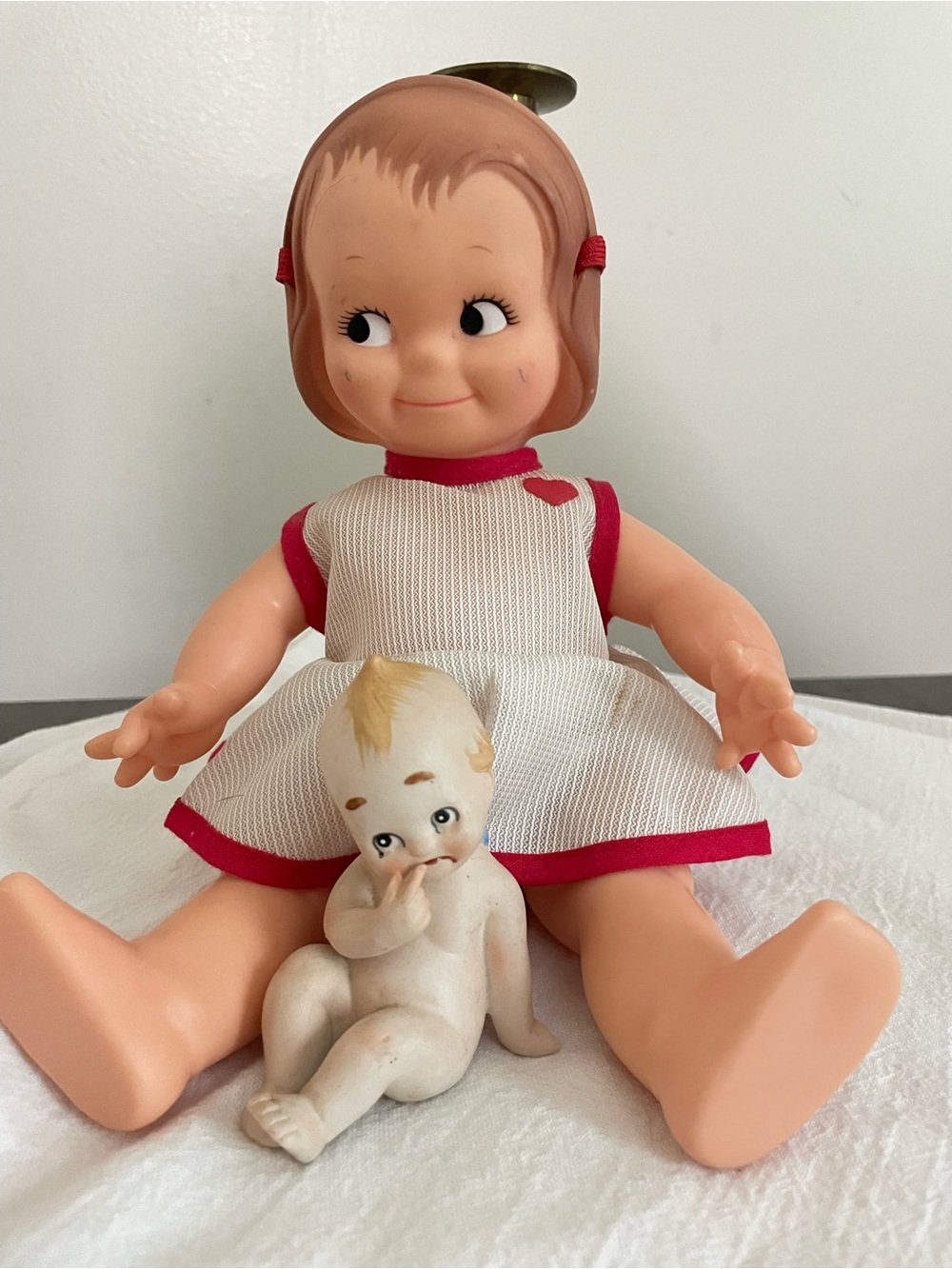 Classic Peach-Colored Girls Doll with Pink-Trim Dress Kewpie
